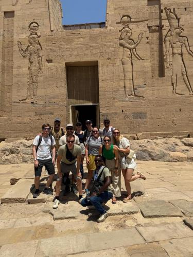 a group of people standing in front of a building at La Veranda 陽台 in Aswan