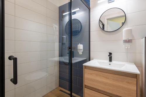 a bathroom with a sink and a shower at Budapest Holidays Downtown in Budapest