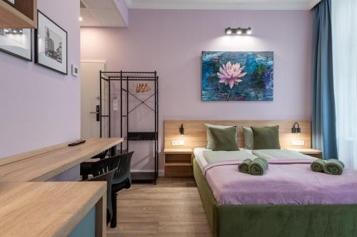a bedroom with a bed and a desk in a room at Budapest Holidays Downtown in Budapest