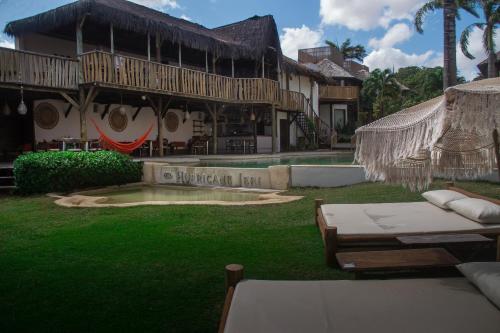 a resort with a pool and a building with a patio at Hurricane Jeri in Jericoacoara