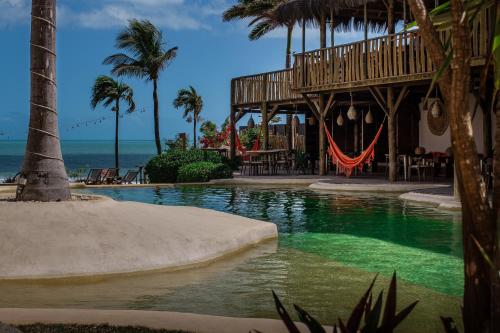 a resort swimming pool with a deck and a playground at Hurricane Jeri in Jericoacoara