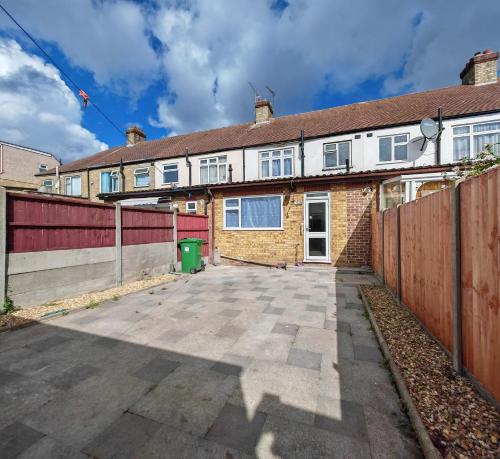 an empty driveway in front of a brick house at 4 Bedroom 2 Bathroom House - Free parking in Ponders End