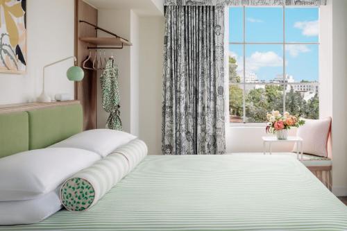 a bedroom with a bed and a window at The Goodtime Hotel, Miami Beach a Tribute Portfolio Hotel in Miami Beach