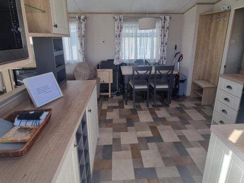 a kitchen with a table and a dining room at Beautiful accomodation 714 Unity Beach Brean Sleeps 4 Pet friendly pets stay free in Brean