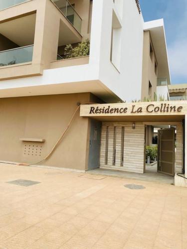 a building with a sign that reads resistance la colume at surf nour house in Tamraght Ouzdar