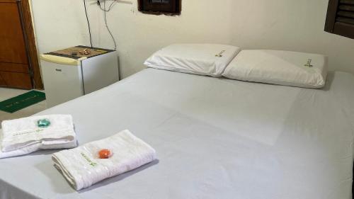 Ένα ή περισσότερα κρεβάτια σε δωμάτιο στο Cantinho GL