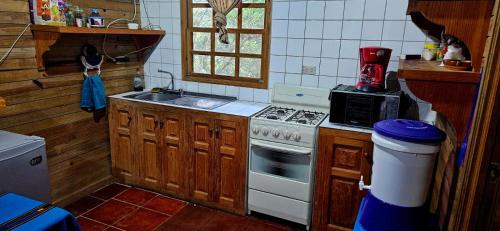 a kitchen with a stove and a sink at Paradise of Atitlan in Santiago Atitlán