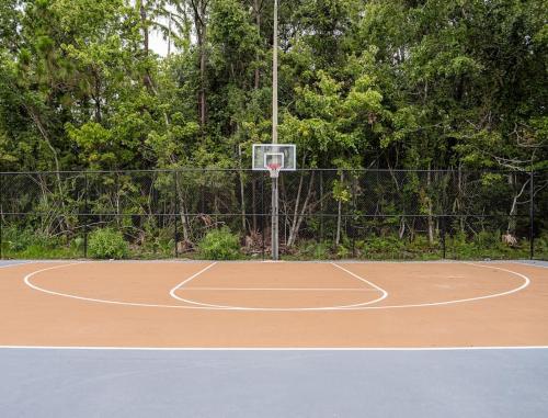 a basketball court with a net on top of it at Chilling 1BR Home in Orlando Next to Disney in Vineland