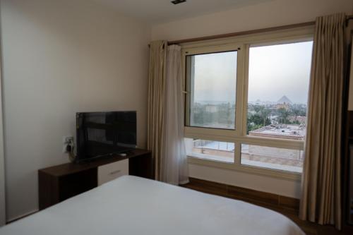 Katil atau katil-katil dalam bilik di Pyramids Sunshine Hotel