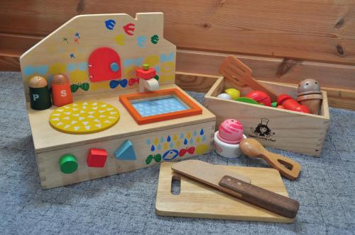 a toy playset with a play kitchen and other toys at Eco-friendly Log Cottage - be with nature in Furano