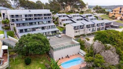 an aerial view of a building with a pool at Horizon Holiday Apartments in Narooma