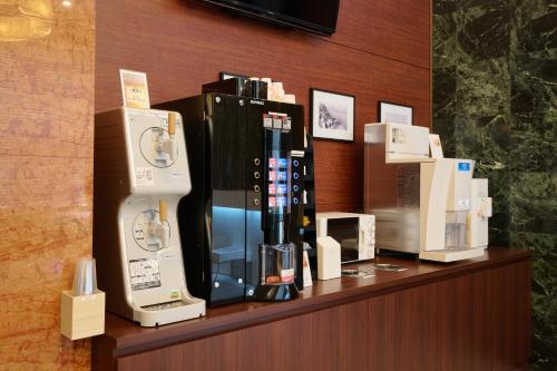 a display of wii machines on top of a counter at キップホテル湘南藤沢 in Kugenuma