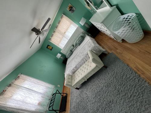 an overhead view of a bedroom with a bed and a window at Home away from home in West Babylon