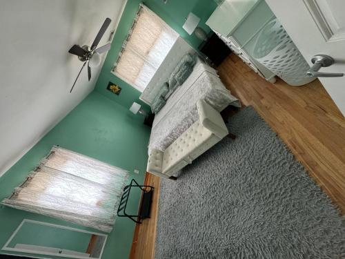 an overhead view of a bedroom with a bed and a window at Home away from home in West Babylon