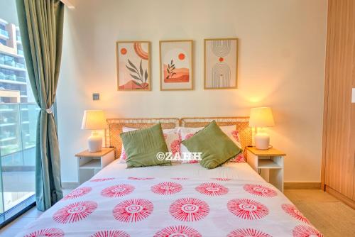 a bedroom with a bed with two lamps and a window at Studio Haven in Dubai