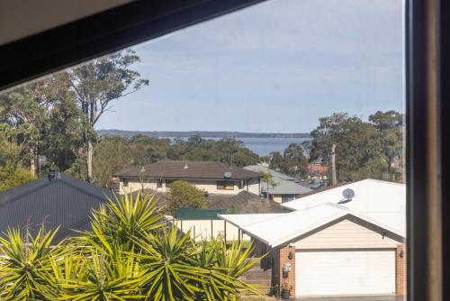 a view from the window of a house at The Atrium by Experience Jervis Bay in St Georges Basin