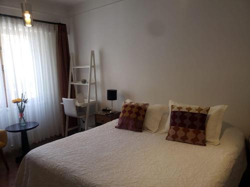 Ένα ή περισσότερα κρεβάτια σε δωμάτιο στο Hostal Boutique Casa La Barca