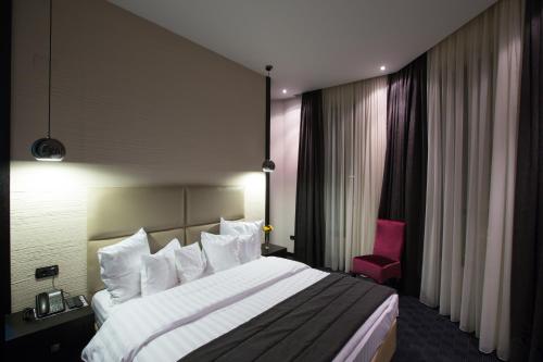 Ένα ή περισσότερα κρεβάτια σε δωμάτιο στο North Avenue by Stellar Hotels, Yerevan