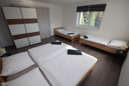 Postel nebo postele na pokoji v ubytování Apartmán u Trojmezí