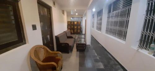 a hallway with a couch and chairs in a store at Experto The Greens in Nainital