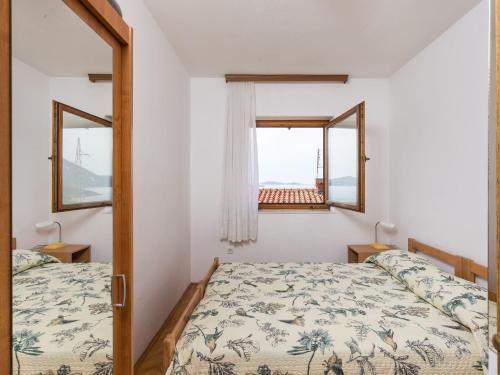 Ένα ή περισσότερα κρεβάτια σε δωμάτιο στο Apartments Kisic-Three Bedroom Apartment with Sea View