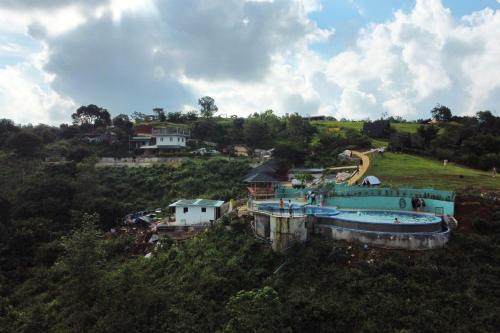 an aerial view of a water park with a swimming pool at Viewscape Nature Park Tanay powered by Cocotel in Tanay