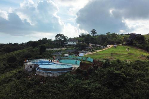 an aerial view of a swimming pool on a hill at Viewscape Nature Park Tanay powered by Cocotel in Tanay