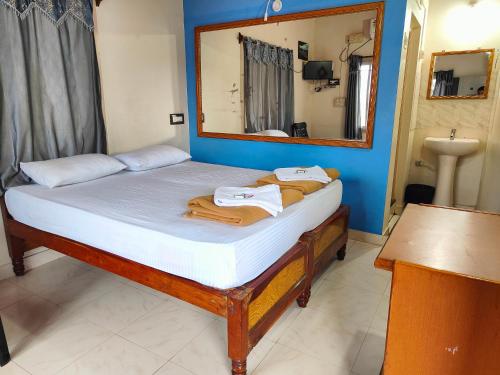 Postel nebo postele na pokoji v ubytování Rocky Guesthouse
