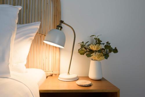 Katil atau katil-katil dalam bilik di Stylish Escape with Sea Breezes & Comfort