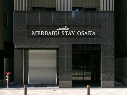 a marriottstay oasis sign on the front of a building at MERBABU STAY OSAKA in Osaka