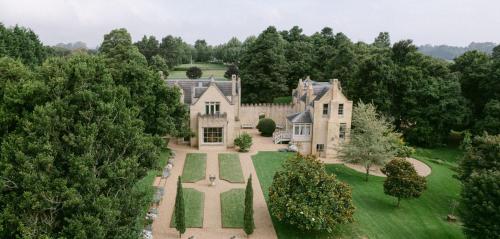 an aerial view of a mansion with trees at Ben Huon Manor, Robertson, Southern Highlands, NSW in Robertson