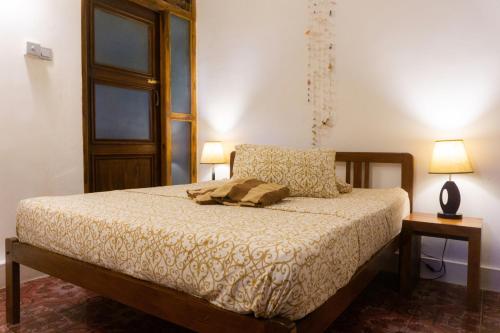 Postel nebo postele na pokoji v ubytování La Maison de Trinco