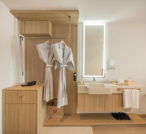 a bathroom with a sink and a mirror at U Hua Hin in Cha Am