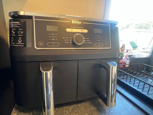 a microwave oven sitting on top of a counter at 75 Lakeside East Haggerston Castle Park in Cheswick