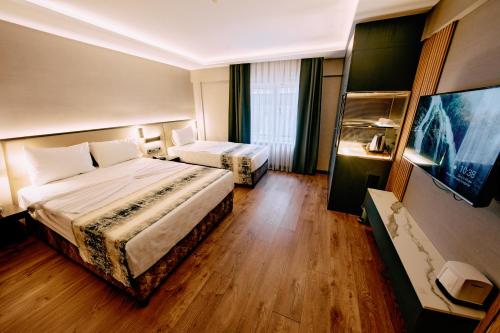 Osmanbey Fatih Hotelにあるベッド