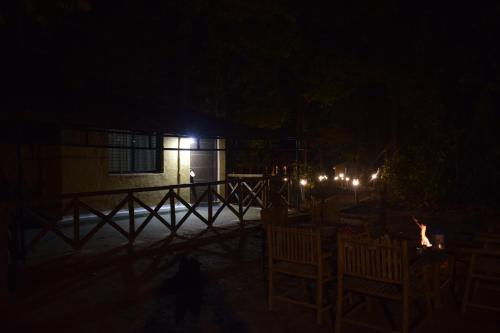a night time picture of a building with lights at Athulyam Kanha, kanha national park, mukki gate in Khāpa