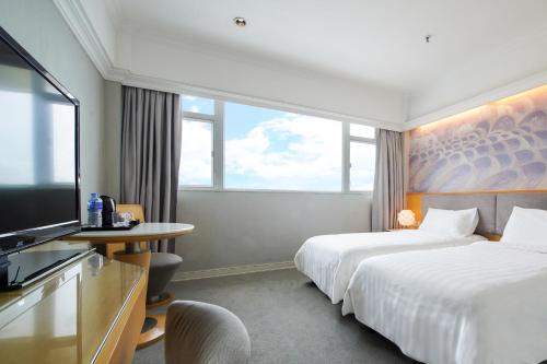Uma cama ou camas num quarto em Warwick Hotel Cheung Chau