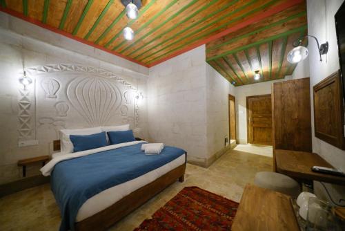 Postel nebo postele na pokoji v ubytování Mayda Cappadocia