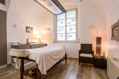 a bedroom with a bed and a window at Château Liblice in Byšice