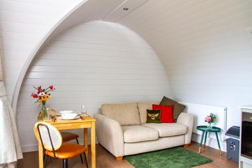 a living room with a couch and a table at Prospect House Farm in Scalby
