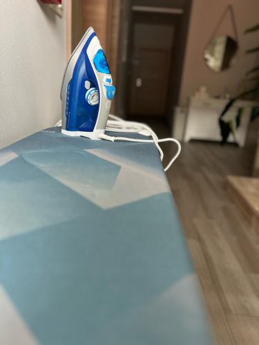 a blue and white iron sitting on top of a counter at Villa Gabriel in Međugorje