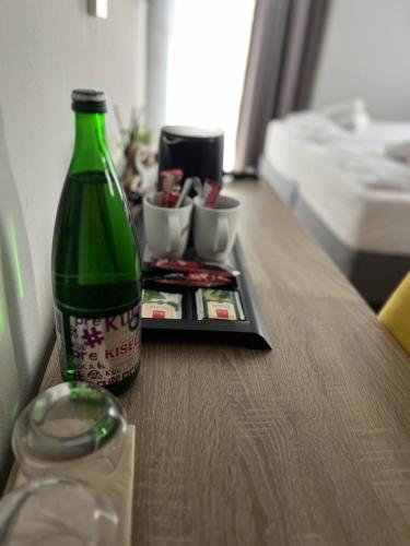 a green soda bottle sitting on a table with a tray at Villa Gabriel in Međugorje