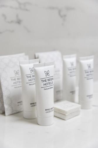 a row of white products sitting on a shelf at Hotel Continentale in Trieste