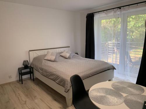Postel nebo postele na pokoji v ubytování Roomflacja