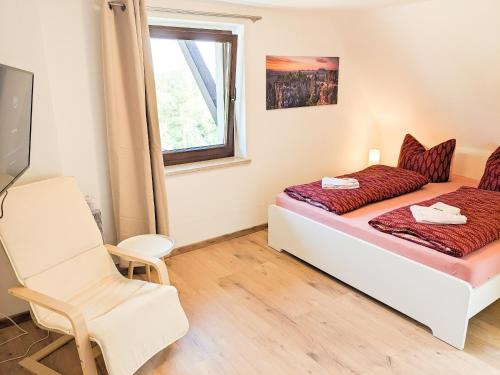 Postel nebo postele na pokoji v ubytování B5 Urlaubsmagie Gemütliche Wohnung inmitten der Sächsischen Schweiz