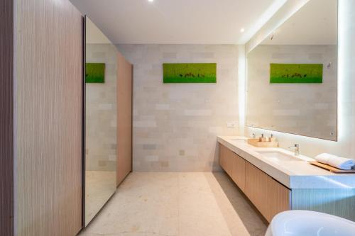 Ένα ή περισσότερα κρεβάτια σε δωμάτιο στο Bali Residence Villa