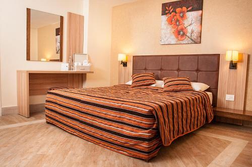 a hotel room with a large bed in a room at Marble Tower in Beirut