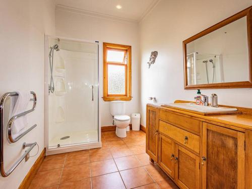 a bathroom with a shower and a sink and a toilet at MJ's Retreat Stunning Ski Season Special for 2024 in Ohakune