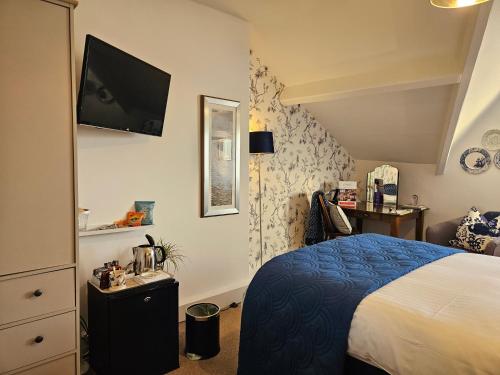 Ένα ή περισσότερα κρεβάτια σε δωμάτιο στο The Broadwater Guest House