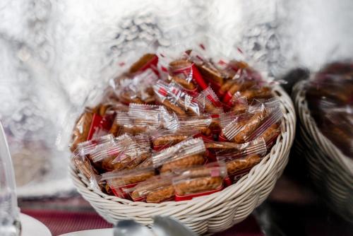 a basket filled with packets of food on a table at Hotel Milano Navigli in Milan